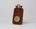 Premium full grain chestnut brown leather golf pocket caddy designed to hold tees, a divot tool, and a magnetic ball marker.